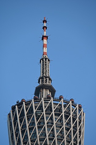 Close-up view of Canton Tower in Guangzhou, showcasing its twisting architectural design and intricate lattice structure.