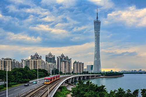 Canton Tower, a famous landmark in Guangzhou, China, standing tall with its iconic twisting design and vibrant LED lighting at night.