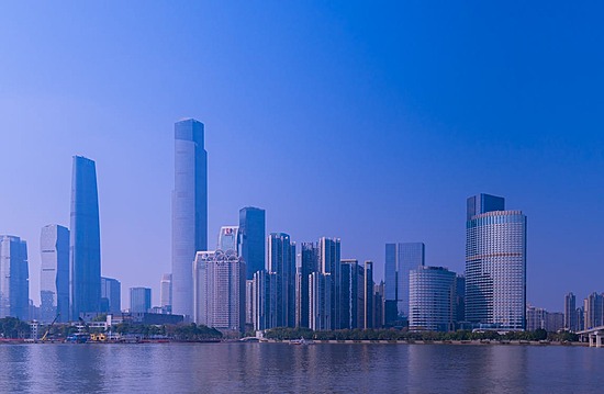 Guangzhou Central Business District (CBD) skyline featuring modern skyscrapers, financial hubs, and urban architecture at dusk.